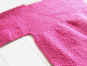 Debbie Bliss "Baby Cardigan," Back, Rakish Angle